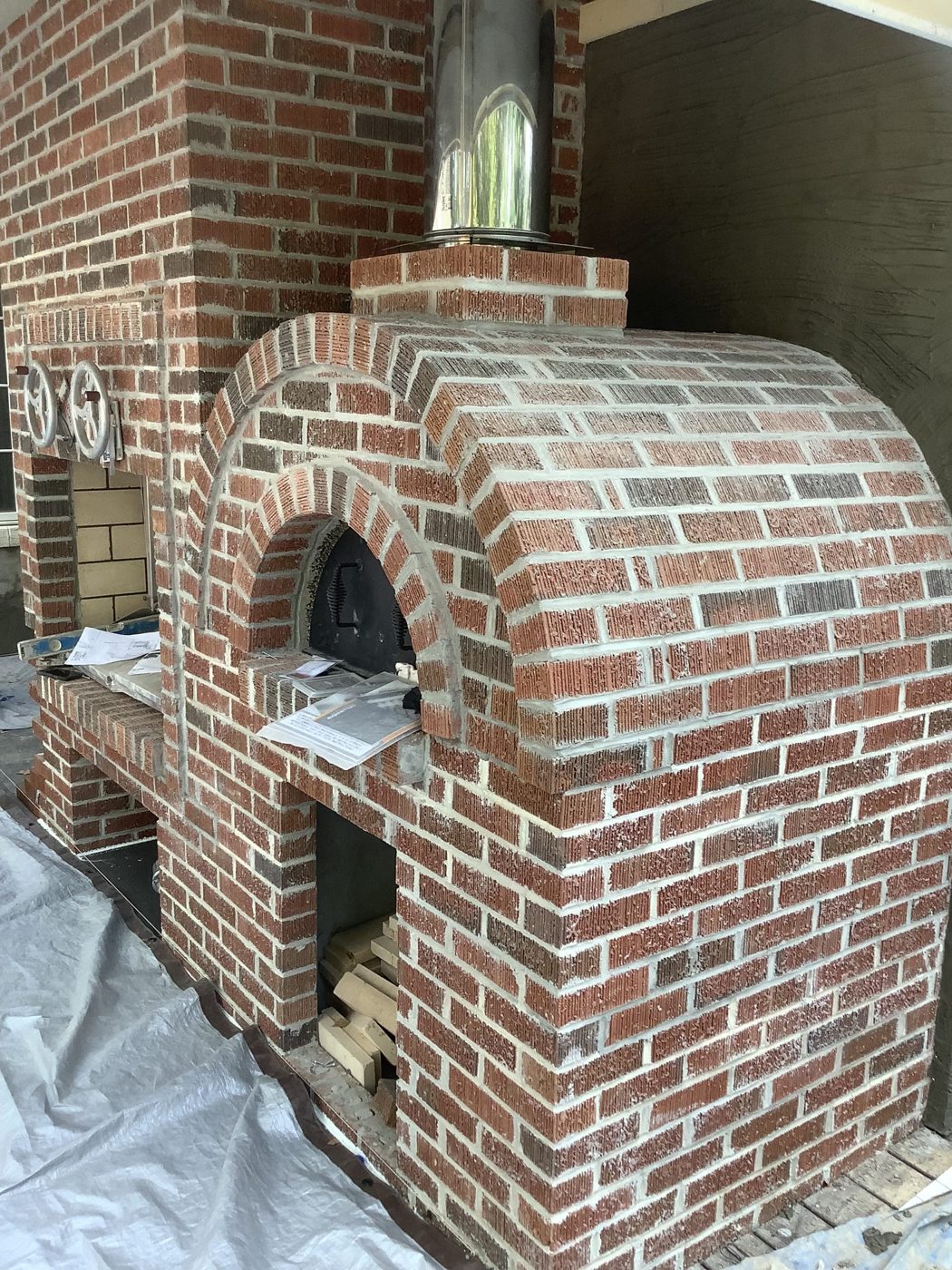 Custom brick fireplace and pizza oven built by B & C Masonry in East Tennessee